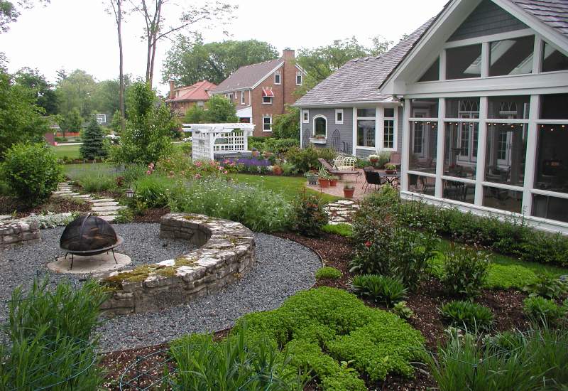 A backyard with a fire pit designed by Western DuPage Landscaping in DuPage County, IL