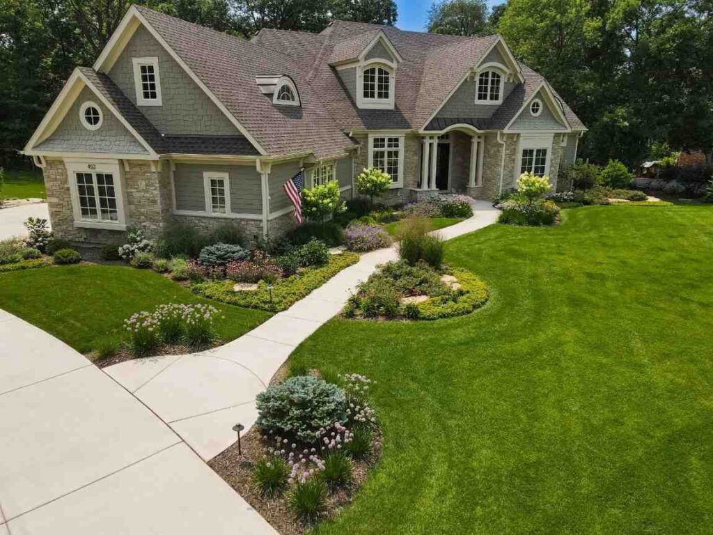 Modern single-level suburban home with groomed front yard in DuPage County
