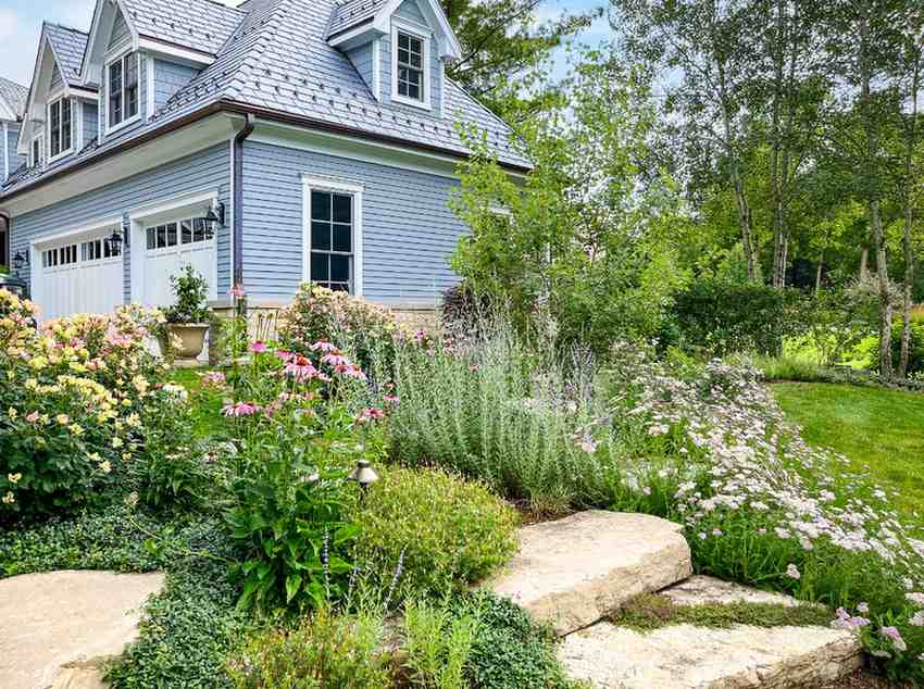 Beautifully landscaped yard with flowers and shrubs around home in DuPage County, IL