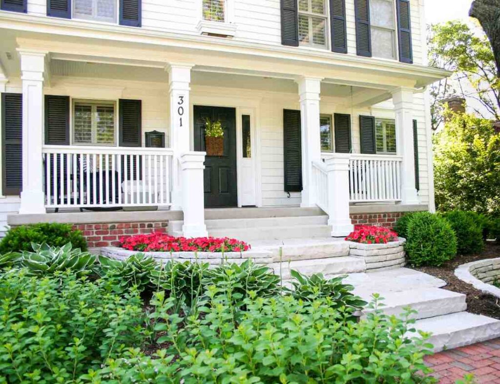 Landscaped front yard with stone steps and lush plants in DuPage County